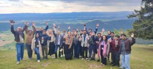 Green HExagon participants raising their hands during an excursion at the international start-up bootcamp